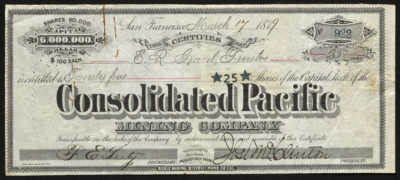 Certificate with black ink shows intricate lettering, signatures, a company seal, and a rust-colored paper clip shape stain