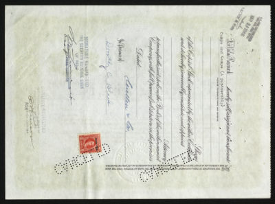 Backside shows legal language with dates, amounts, signatures, punched out cancelled stamps and a red IRS stamp