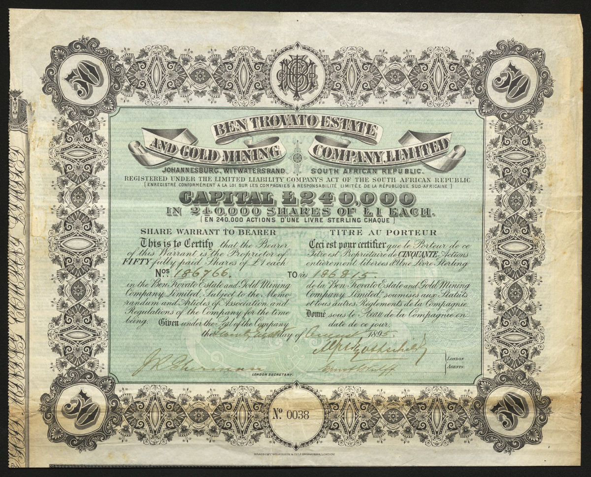 Certificate with black and green ink shows intricate borders and lettering, and a family seal