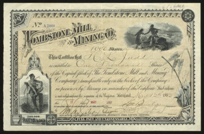 Certificate with black ink shows intricate borders, lettering, and vignettes with Native Americans-one with a bow, a train, and flora