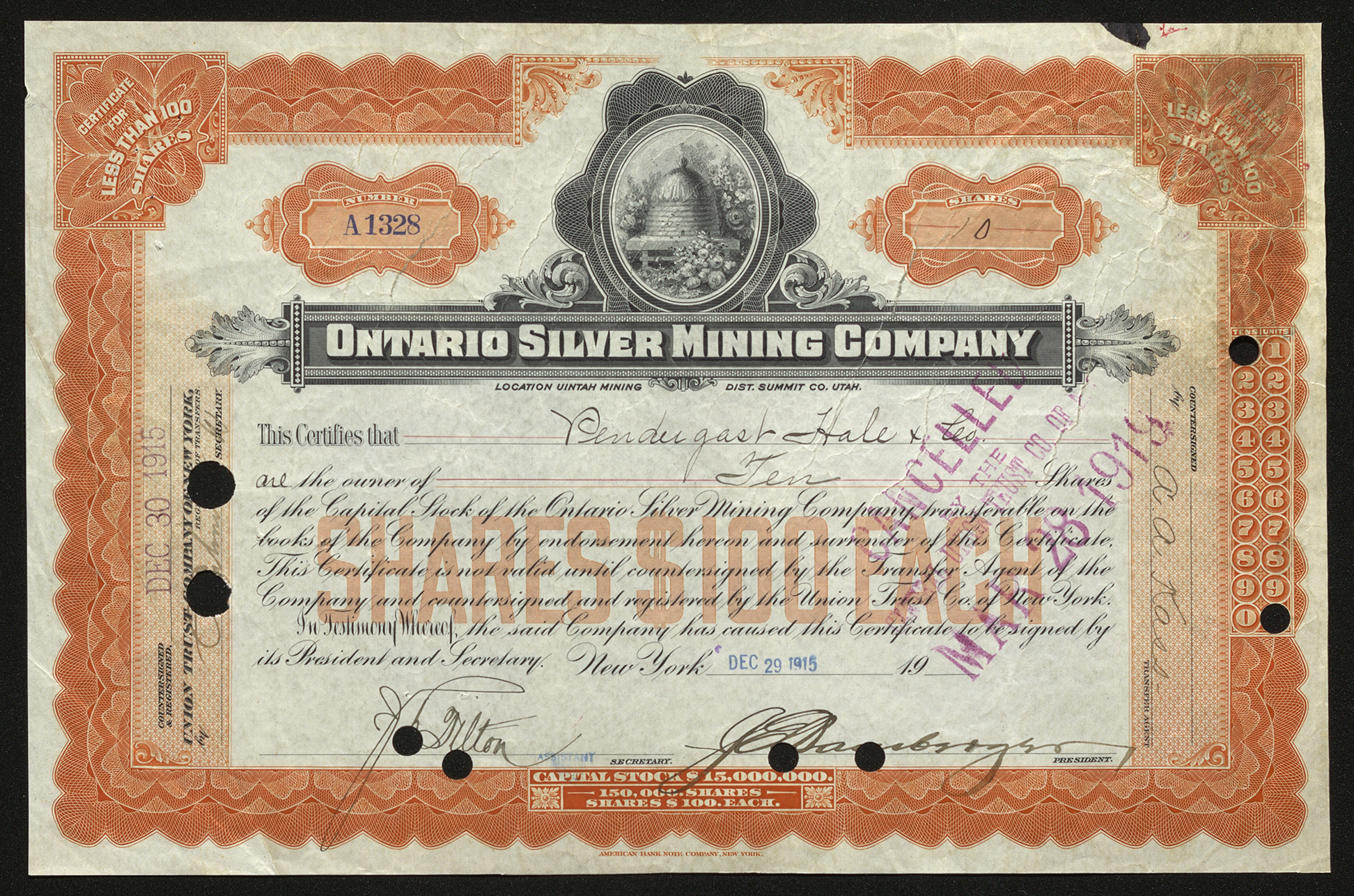 Certificate with black and orange ink shows intricate borders, lettering, a vignette with flowers surrounding a small wooden structure