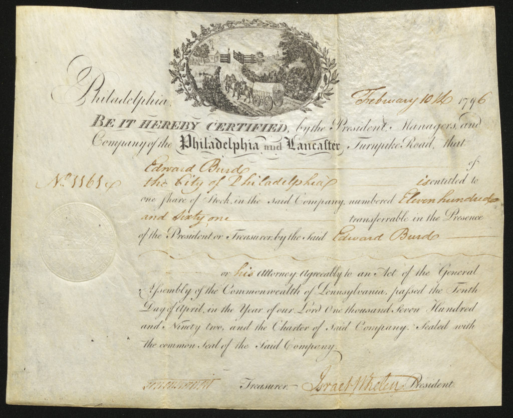 Certificate with black handwritten ink, a seal, and an intricate vignette showing a horse-drawn carriage near a gate and house behind lots of flora
